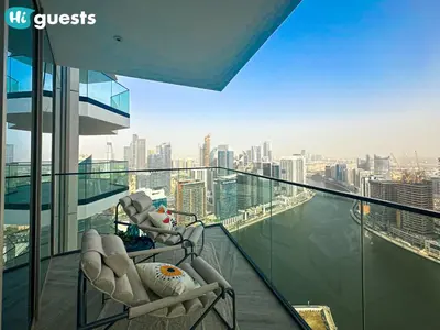 a balcony with a view of a city skyline at HiGuests - Peninsula Luxury 1 BR with Stunning Water Views in Dubai