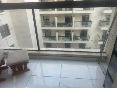 a view of a large building from a window at Twin tower in Dubai