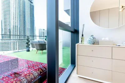 a bedroom with a view of a city at 1BR Plus Studio Apartment With Burj View In Downtown Dubai in Dubai
