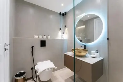 a bathroom with a sink and a mirror at Modern 2BR Prime Downtown Location in Dubai