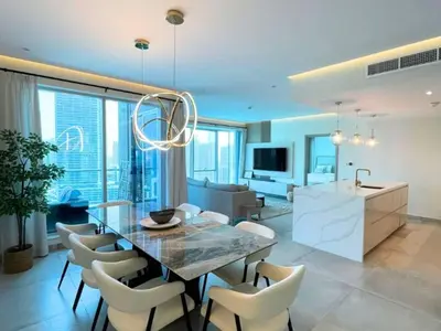 a kitchen and dining room with a table and chairs at Luxury 2 Bedroom Shemara Tower Dubai Marina in Dubai