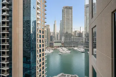 a view of a river in a city with boats at FIRST CLASS 1BR Luxury Marina View Escape in Dubai