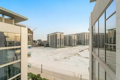 an aerial view of a construction site between two buildings at FIRST CLASS 1BR Relaxing Urban Escape in Dubai