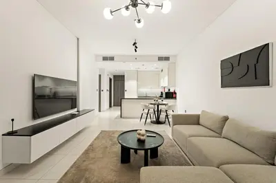 a living room with a couch and a table at FIRST CLASS 1BR Relaxing Urban Escape in Dubai