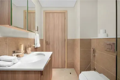 a bathroom with a sink and a toilet at Luxury 2BR w City View Balcony in Dubai