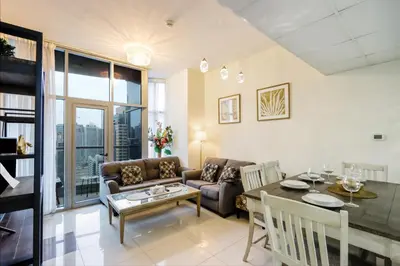 a living room with a couch and a table at Prime Located 3B with full Marina Views, Near Beach & Marina Mall in Dubai