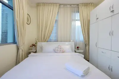 a bedroom with a white bed and a window at Prime Located 3B with full Marina Views, Near Beach & Marina Mall in Dubai