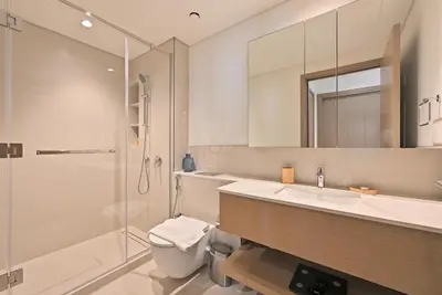 a bathroom with a sink and a shower at Luxury 1BR Beach Access Creek Beach in Dubai