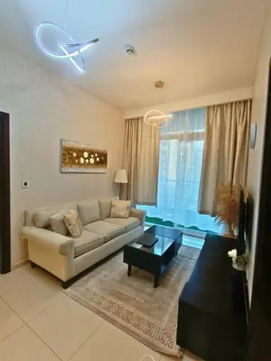 a living room with a couch and a table at Canal View - 10 Minutes Walk to Dubai Mall in Dubai