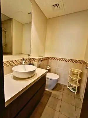 a bathroom with a sink and a toilet at Canal View - 10 Minutes Walk to Dubai Mall in Dubai