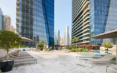 a patio in a city with benches and buildings at Silverene Tower A, Dubai Marina - Mint Stay in Dubai
