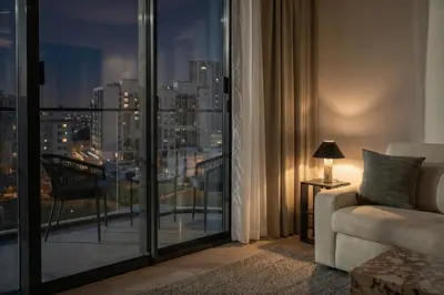 a living room with a view of a city at Stylish 1BR with Pool & Gym Access in Dubai