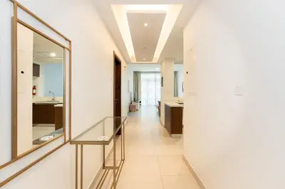 a hallway of a bathroom with a mirror at CitiHome - Spacious 2BR - Park Gate Residences in Dubai