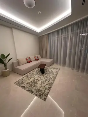 a living room with a couch and a rug at have fun with your family and friends in our apt in Dubai