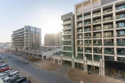 an aerial view of a city with tall buildings at Stylish City Studio with Balcony View in Meydan in Dubai