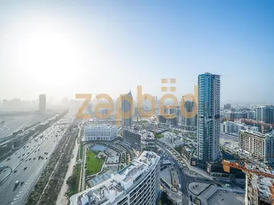 an aerial view of a city with buildings and cars at Stylish 2BR Apartment Skyz By Danube Arjan in Dubai