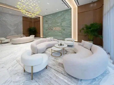 a lobby with white couches and a table and chairs at Luxury 2BR W Private Pool Binghattti Onyx in Dubai