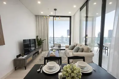 a living room with a couch and a table at Luxury 2BR W Private Pool Binghattti Onyx in Dubai