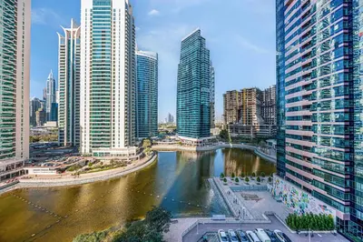 a view of a river in a city with tall buildings at Daniels Studio with Lake View in JLT in Dubai