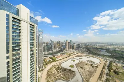 an aerial view of a city with tall buildings at Daniels 2BR with Canal View at Aykon City in Dubai
