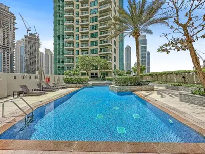 a swimming pool in the middle of a city at Stylish 1BDR Fully Upgraded Near Burj Khalifa in Dubai