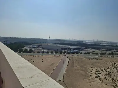 a view of a desert with a road and a building at Equity Gate 217 in Dubai