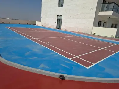 a tennis court in front of a building at Equity Gate 217 in Dubai