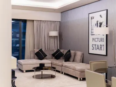 a living room with a couch and a table at Hollywood Glamour Epic Burj Views at DAMAC Towers by Paramount in Dubai