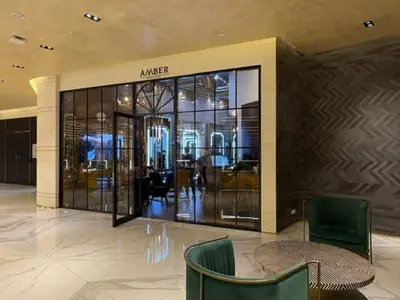 a shopping mall with a glass entrance to a store at Hollywood Glamour Epic Burj Views at DAMAC Towers by Paramount in Dubai