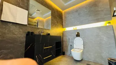 a bathroom with a toilet and a sink at 1 Bedroom with Balcony - Near Metro - Fast Wi-Fi in Dubai