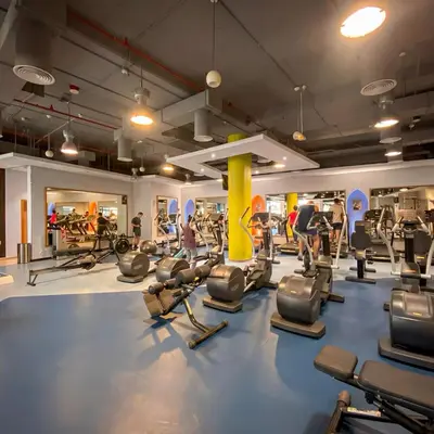 a gym with a lot of treadmills and machines at Stunning Sea View - 2-BR - 2 min Walk to Beach in Dubai