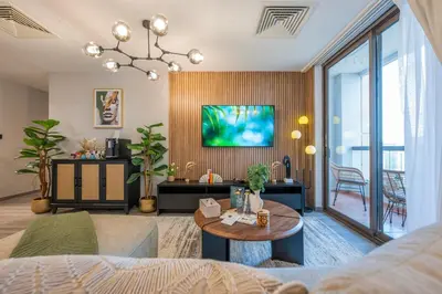 a living room with a couch and a tv at Boutique 3BR in JBR Upgraded by UDH in Dubai
