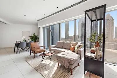 a living room with a couch and a table at Silkhaus Modern Studio in Central Park Tower DIFC in Dubai