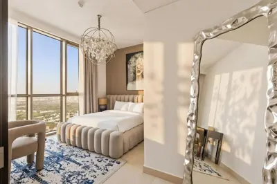 a bedroom with a bed and a mirror at Luxury 2 Bedroom Apartment In Downtown in Dubai