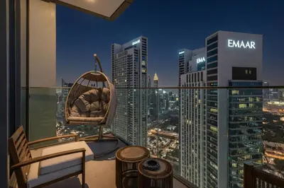 a balcony with a chair and a city skyline at Luxury 2 Bedroom Apartment In Downtown in Dubai