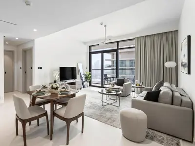a living room with a table and chairs and a couch at Breathtaking 1 BDR with Palm & Marina View-25 in Dubai
