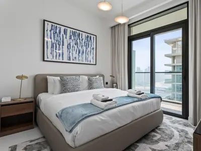 a bedroom with a large bed and a large window at Breathtaking 1 BDR with Palm & Marina View-25 in Dubai