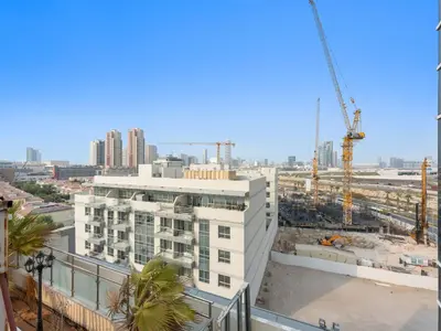 a view of a building under construction with a crane at Modern Comfort City Studio In Al Manara 04 in Dubai