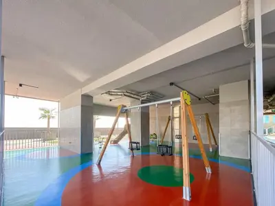 an empty gym with an empty gym with swings at Vogue Elite Business Bay Residence Close to Burj Khalifa and Dubai Mall, Studio Apartment with Balcony, City and Canal View, Access to all Amenities in Dubai