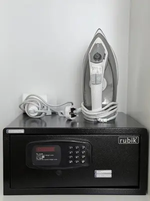a microwave with an electronic device on top of it at Luxury 1BR Retreat with Dubai Marina views by Crescent Key in Dubai