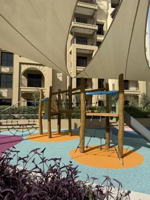 a patio with a table and an umbrella in front of a building at Luxury 1BR Retreat with Dubai Marina views by Crescent Key in Dubai