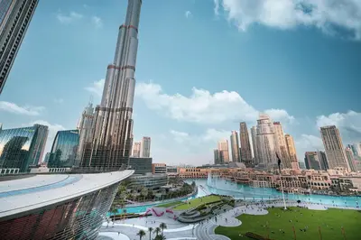 a view of a city with a tall skyscraper at INCREDIBLE BURJ KHALIFA & DUBAI FOUNTAIN Views - 2 BR Luxury Apartment - Sanctuary Stays in Dubai