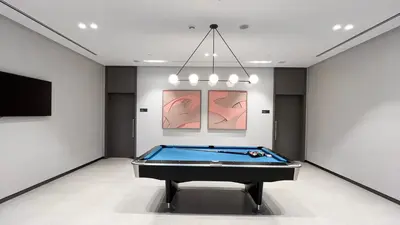 a room with a pool table in a room at INCREDIBLE BURJ KHALIFA & DUBAI FOUNTAIN Views - 2 BR Luxury Apartment - Sanctuary Stays in Dubai