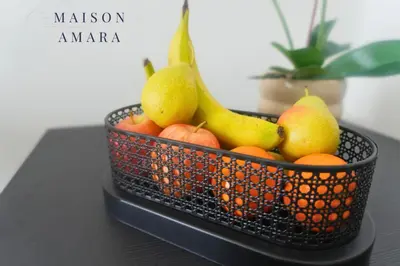 a basket of fruit sitting on a table at Modern Luxurious Studio Golf View Damac Community in Dubai