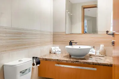 a bathroom with a sink and a toilet at FIRST CLASS 2BR Spectacular Marina Views in Dubai
