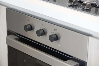 a close up of a stove top oven at LUX 2 BDR apartment - Burj Khalifa view in Dubai