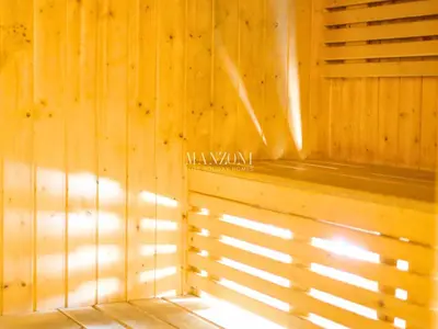 a room with a wooden wall with the sun shining through the window at Business Bay Luxury Apt - 5min Burj Khalifa, Mall & Metro in Dubai