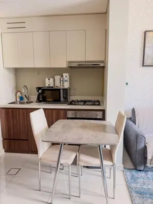 a kitchen with a table and chairs in a room at BurjKhalifa View | 1BR Business Bay Near Dubaimall in Dubai