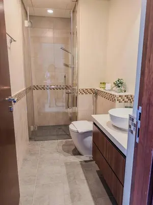 a bathroom with a shower and a toilet and a sink at BurjKhalifa View | 1BR Business Bay Near Dubaimall in Dubai