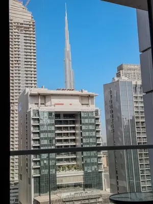 a view of a city skyline with a tall building at BurjKhalifa View | 1BR Business Bay Near Dubaimall in Dubai